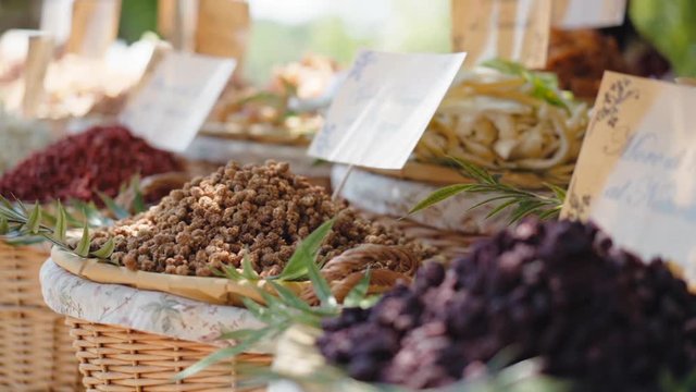 Large counter of dried fruits and nuts at the artisan traditional market, mixture of healthy dry fruits for selling. Baskets full of variety of dried fruits, natural product full of vitamins. Artisan