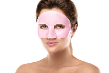 Young beautiful woman with rubber facial mask on her face