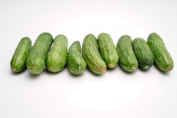 crunchy mini cucumber on white isolated background