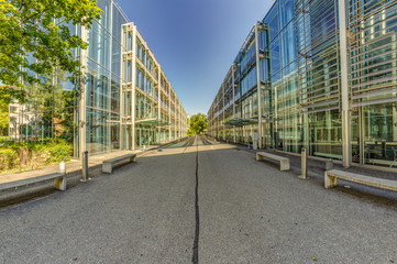 Fototapeta na wymiar Bern, Switzerland - July 30, 2019: A modern metal concrete and glass mounted building in the Swiss Capital. Panoramic. View at sunny summer day