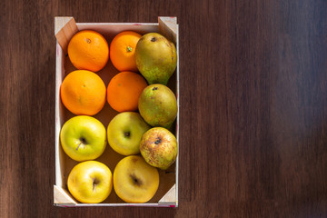 overhead view of box with assorted fruit