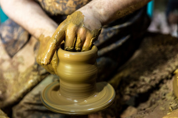 hands of a potter at work
