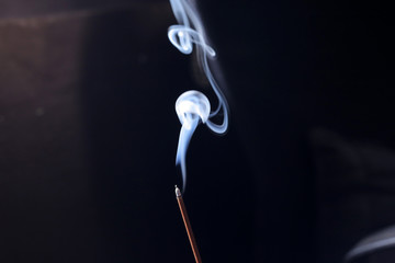 incense sticks on a blue background