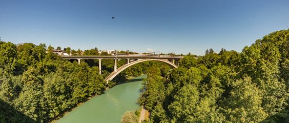 Bern, Switzerland - July 30, 2019: Railway bridge over the river. Train driving by the Bridge over...