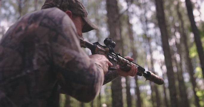 Man shooting gun while hunting