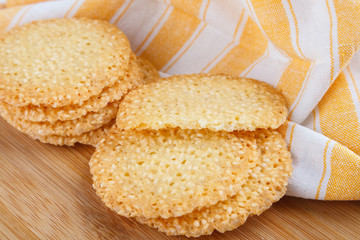 Group of cookies with sesame seeds on wooden board. healthy food. Close up view