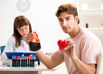 Man giving his blood as a donor
