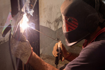 Fototapeta na wymiar Close up working with welding machine