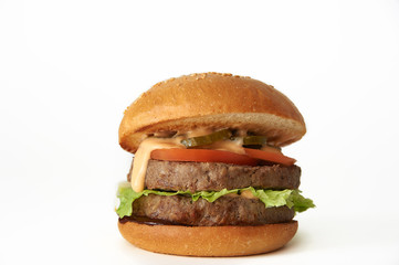 Classic double hamburger with cutlets semi-finished products on a white background.