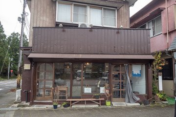 Classic coffee shop in charming wooden japanese house beside the public footpath, background, copy space