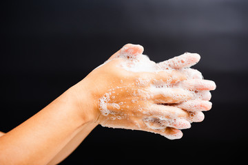 woman washing hands with soap have foam