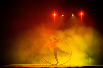 Muscular circus performer spin in the wheel © SGr