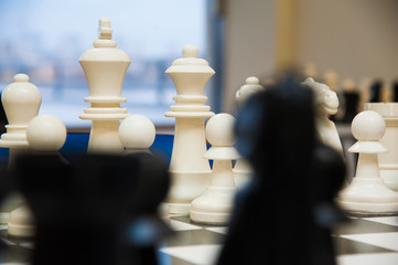 Chess tournament tables with chess timers and blank note papers