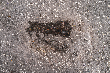 Cracked concrete and asphalt