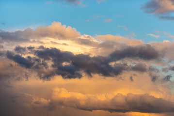 bright and juicy clouds at sunset with blue sky