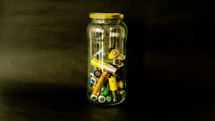 still life of batteries to recycle at home