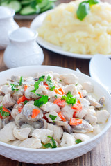 Chicken fillet with mushrooms in sour cream sauce, selective focus