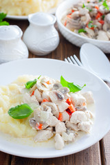 Chicken fillet with mushrooms in sour cream sauce, selective focus