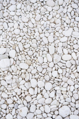 White pebble stone texture on the ground