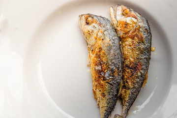 background of the fried fish menu (mackerel)that is fried in fish sauce until the skin is scorched,eaten with steamed rice,an alternative health menu that people like to order in restaurants