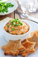 Homemade herring pasta with slices of brown bread, mincemeat, selective focus