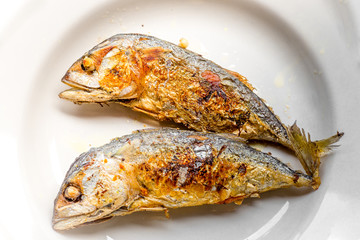 background of the fried fish menu (mackerel)that is fried in fish sauce until the skin is scorched,eaten with steamed rice,an alternative health menu that people like to order in restaurants