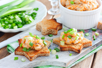 Homemade herring pasta with slices of brown bread, mincemeat, selective focus