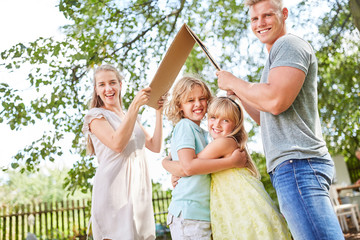 Fototapeta premium Children hug under umbrella