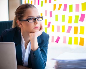 Beautiful female employee with many conflicting priorities