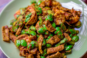 blurred background view of the spicy southern Thai food(stir-fried spicy Sato with fresh prawns),which has a mixture of colorful spices catching the customers, a popular menu eaten with steamed rice