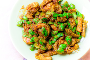 blurred background view of the spicy southern Thai food(stir-fried spicy Sato with fresh prawns),which has a mixture of colorful spices catching the customers, a popular menu eaten with steamed rice
