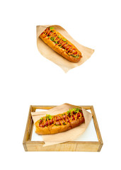 Hot dog with salad and cucumbers with tomato ketchup and mustard on white background. Tasty and beautiful fast food on a light back.