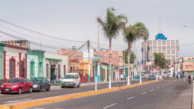Monumental Callao is one of the new fashion areas near Lima timelapse. Gamara street traffic with colorful houses and restaurants. Lima Peru.