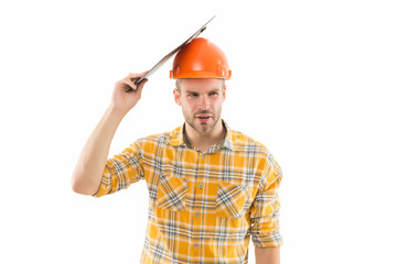 Guy in trouble. Renovation concept. Planning changes renovation. Foreman with documents. Supplies dealer. Project curator. Counting finances renovation. Man safety hard hat. Redevelopment of home