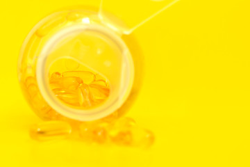 Fish oil capsules with omega 3 and vitamin D, healthy eating concept