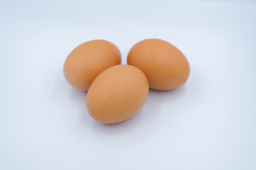 Three eggs isolated on white background.