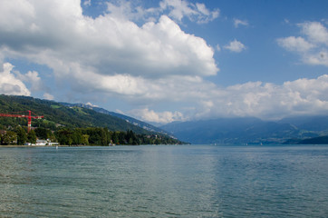 Fototapeta premium Mountain lake against the backdrop of the Alpine mountains