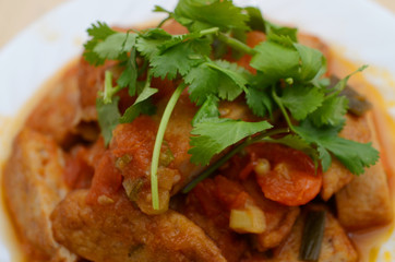 Fried fishcakes slices with tomato sauce