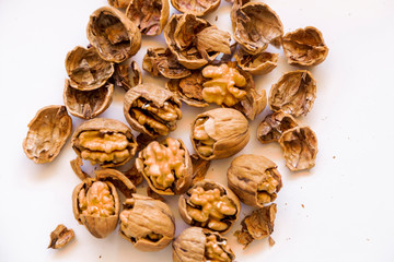 pilled walnut isolated on white background. Composition from nuts on the white isolated background