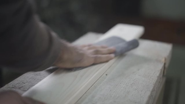 Processing and sanding of a wooden surface with sandpaper