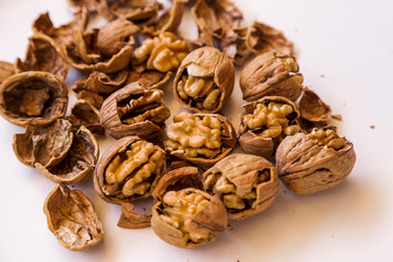 pilled walnut isolated on white background. Composition from nuts on the white isolated background