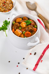 Beef Stew with Potatoes and Carrots made in a Slow Cooker. Selective focus.
