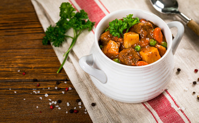 Beef Stew with Potatoes and Carrots made in a Slow Cooker. Selective focus.