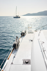 Catamaran and yacht in the sea, background. Vacation concept.