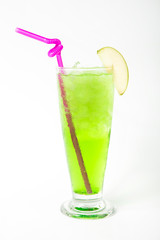 green apple juice drink in a tall glass decorated with sliced green apple isolated white background