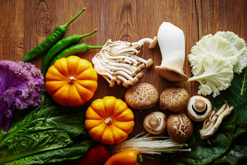 Various vegetable and mushroom on wooden background 