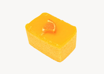 Orange cake with a piece of sliced orange on topping isolated on white background with clipping path or make selection. Sweet homemade or dessert food