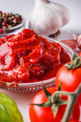 fresh natural tomato paste on a white background