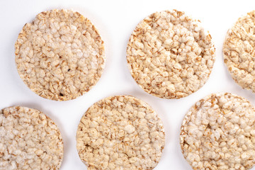 Puffed rice cakes on white background. Flat lay, top view. Rice waffle. copy space