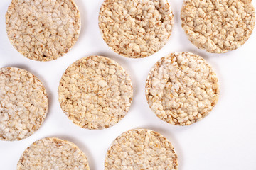 Puffed rice cakes on white background. Flat lay, top view. Rice waffle. copy space